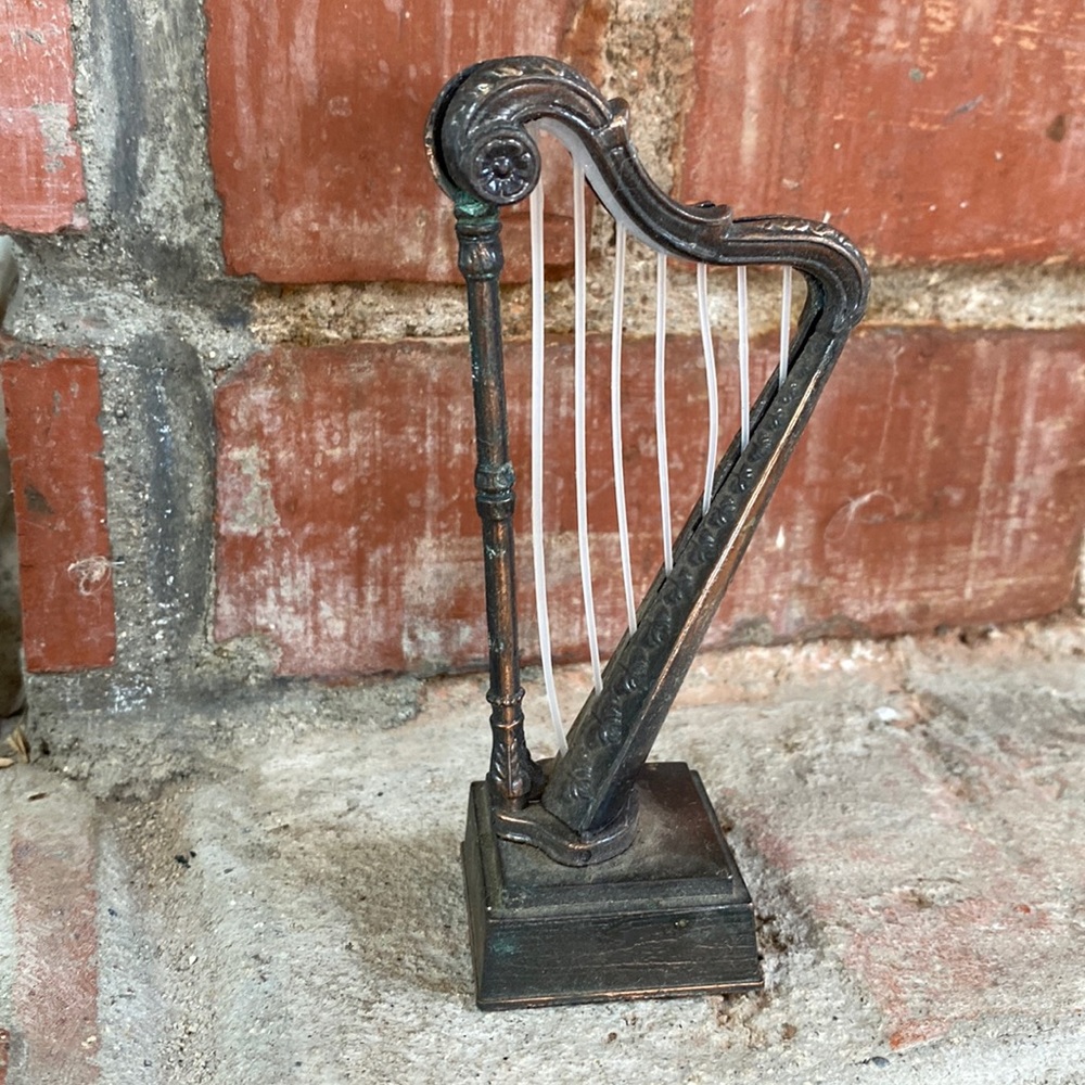 Die cast metal harp pencil sharpener